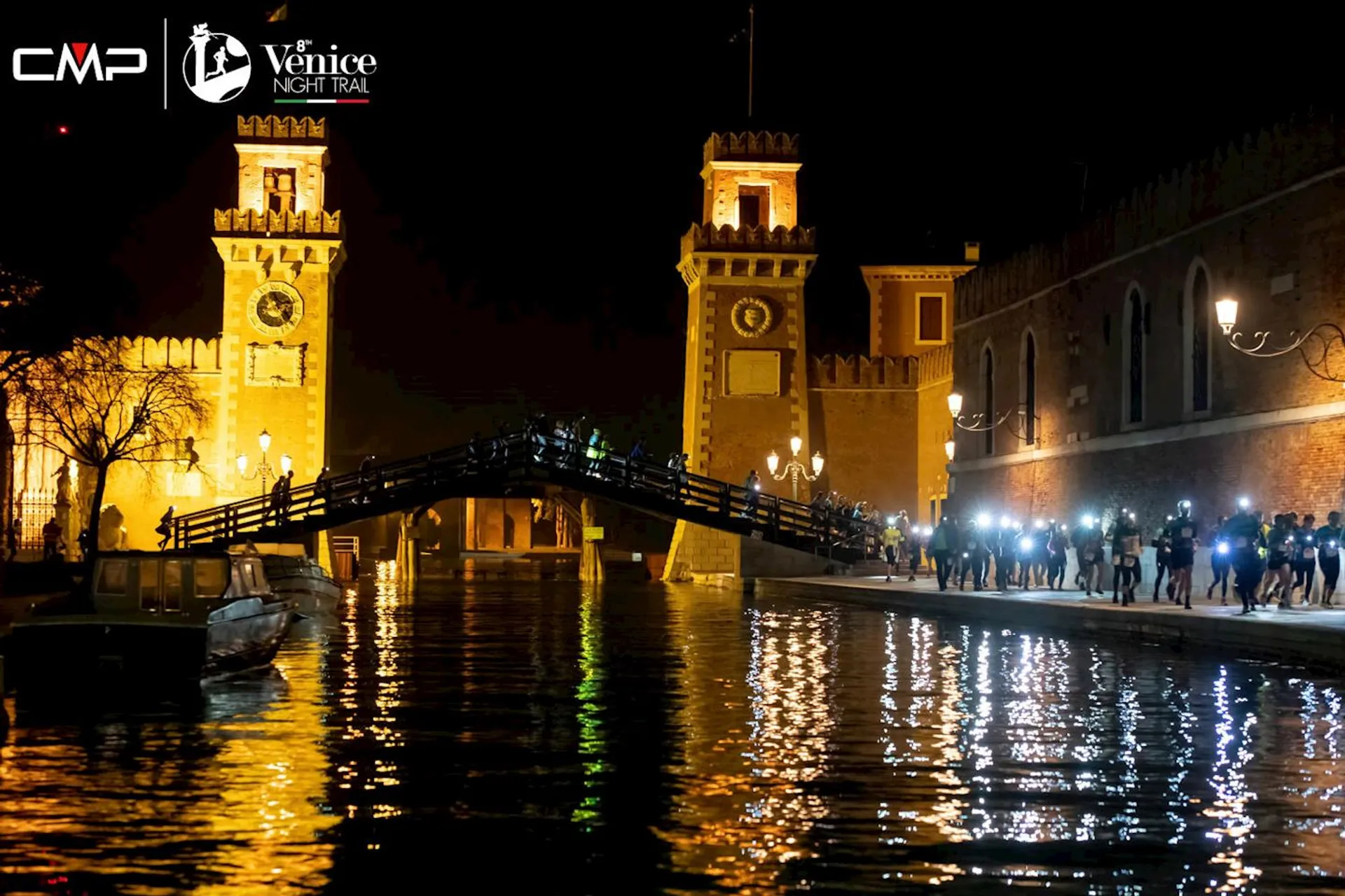 The image appears to be taken at a night-time event in Venice, as indicated