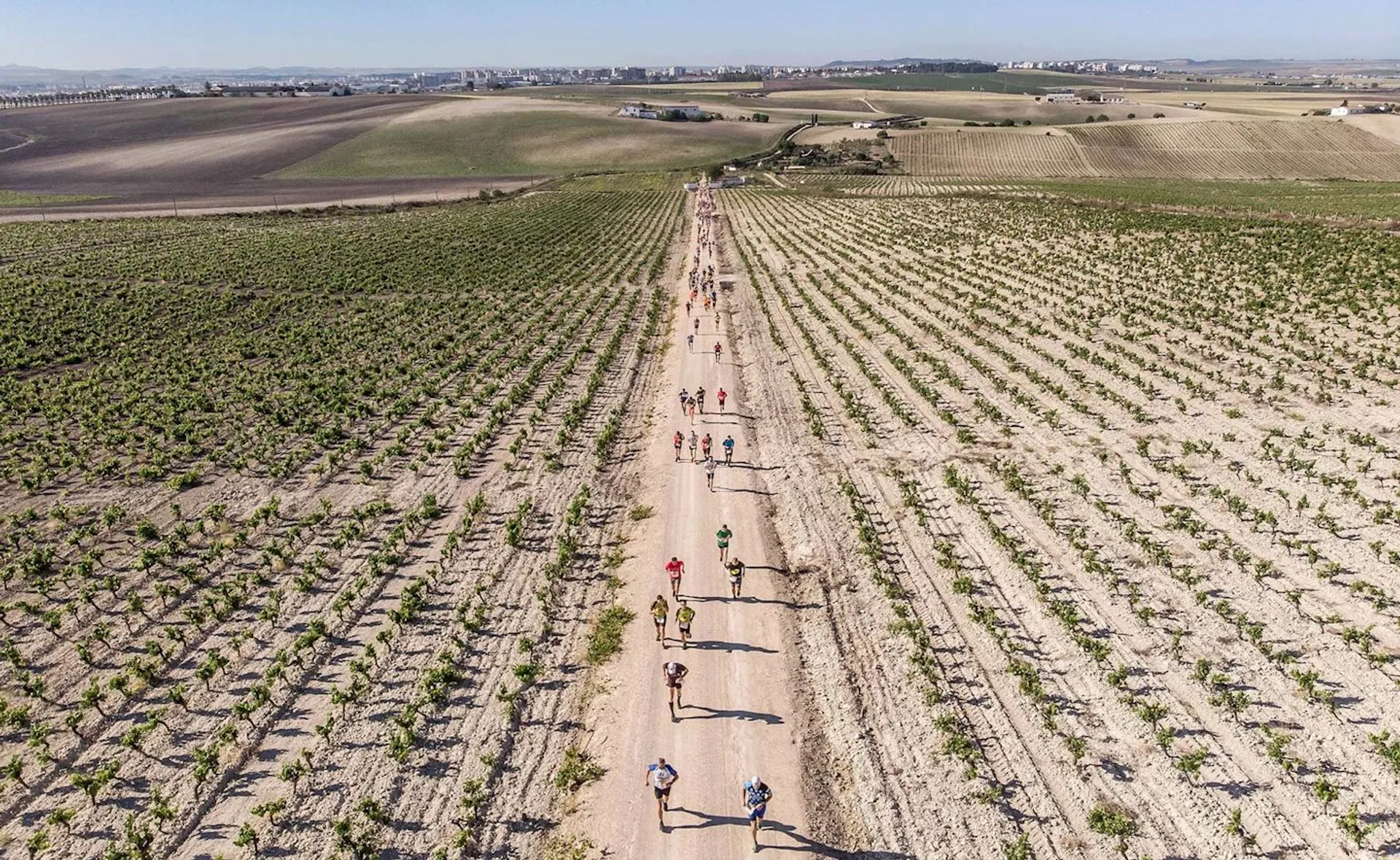 The image shows a group of people on what appears to be a long, straight