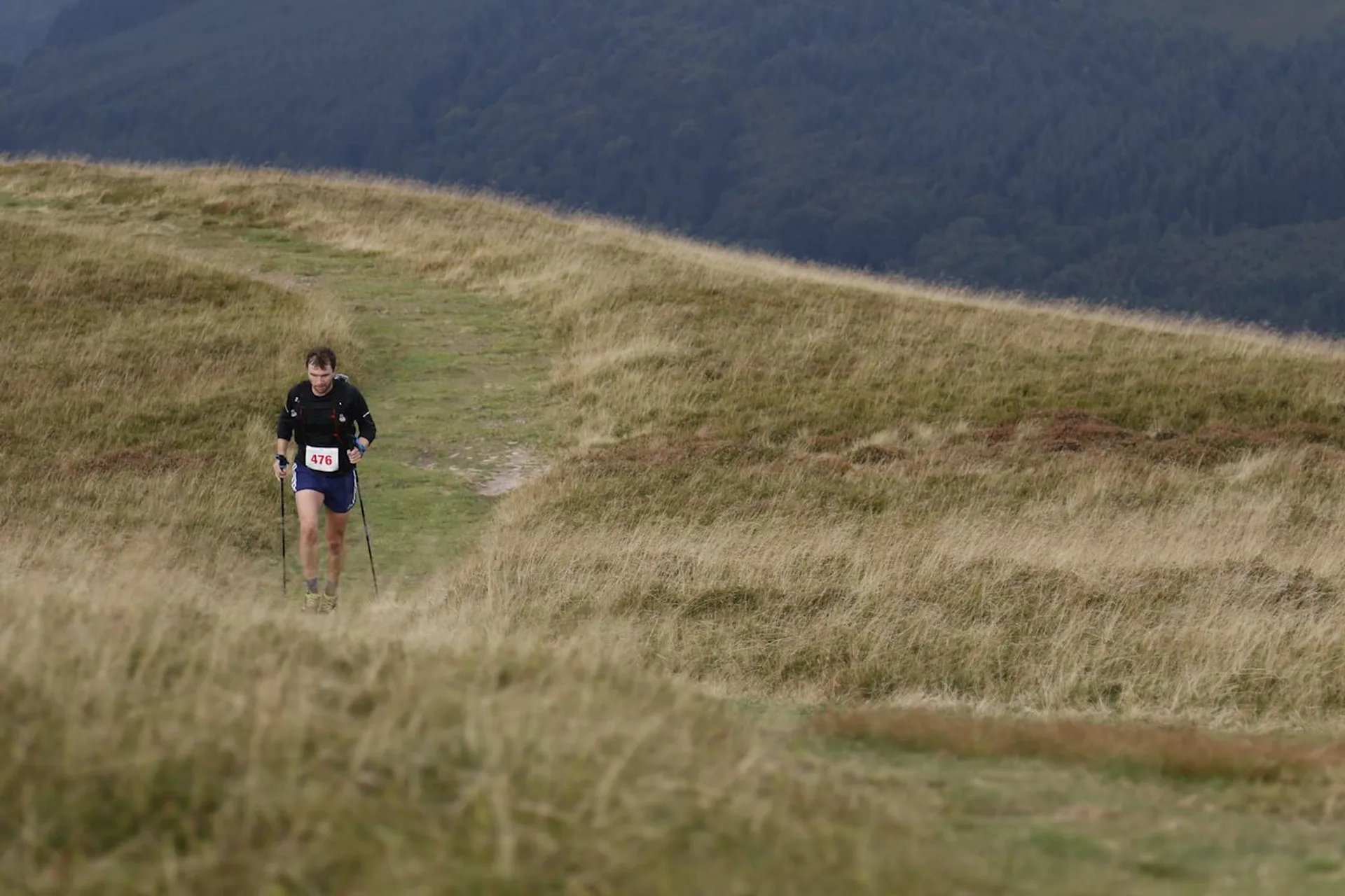 The image shows an individual participating in what appears to be an outdoor running event,