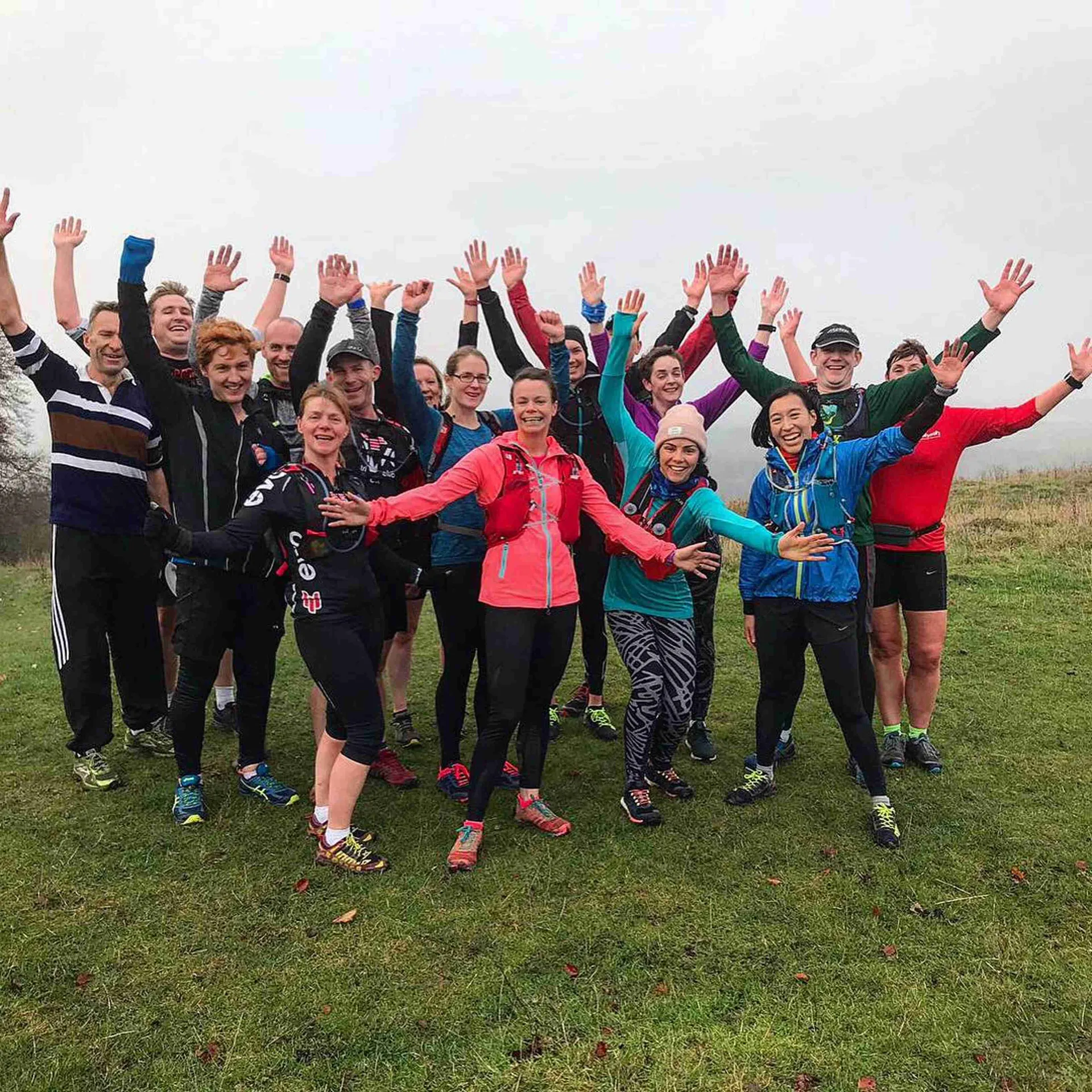 The image features a group of people outdoors, possibly a running or sports club,