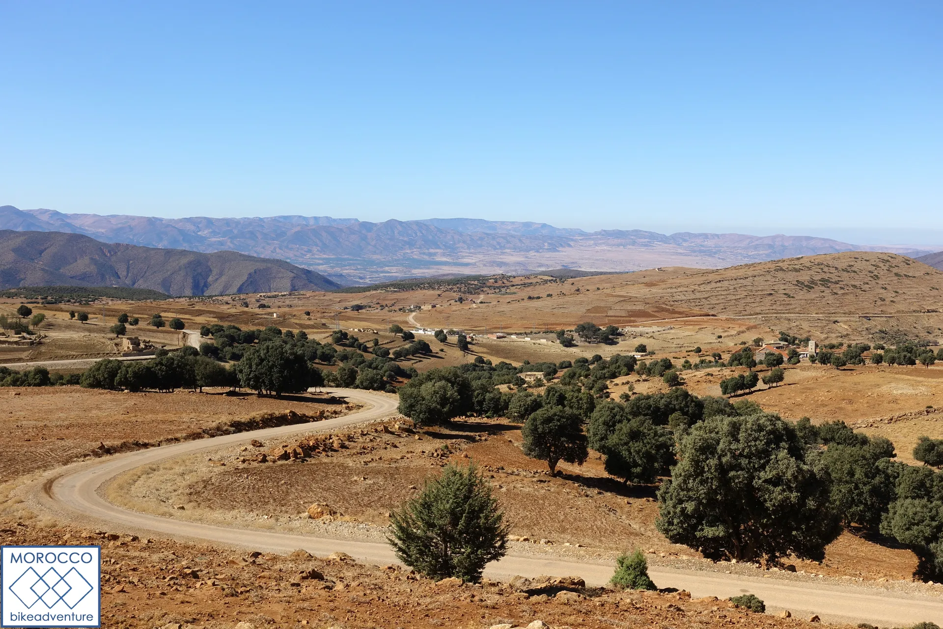 The image depicts a scenic landscape view, likely taken from a higher vantage point
