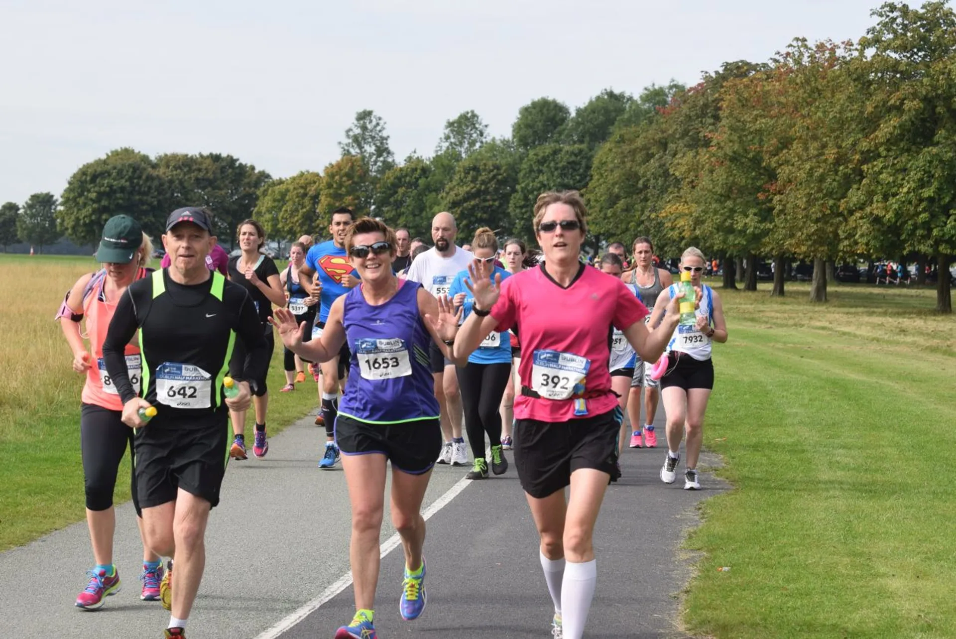 This image shows a group of runners participating in a race or marathon. They are