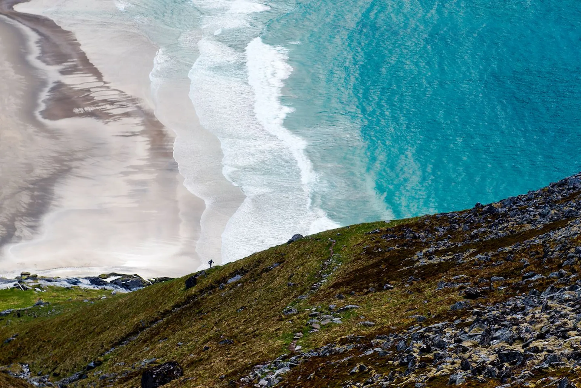 This image shows a scenic coastal landscape. At the top of the image is a