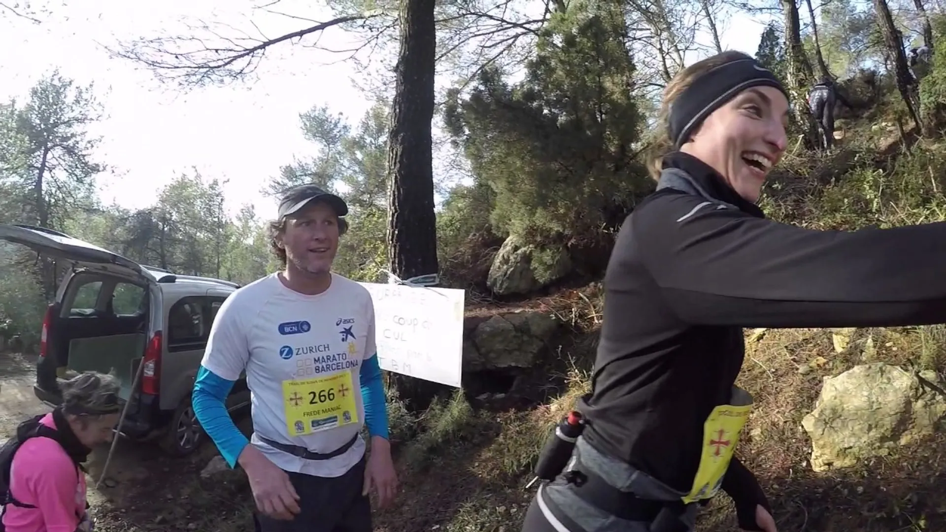 The image shows a group of people participating in what looks like an outdoor event,