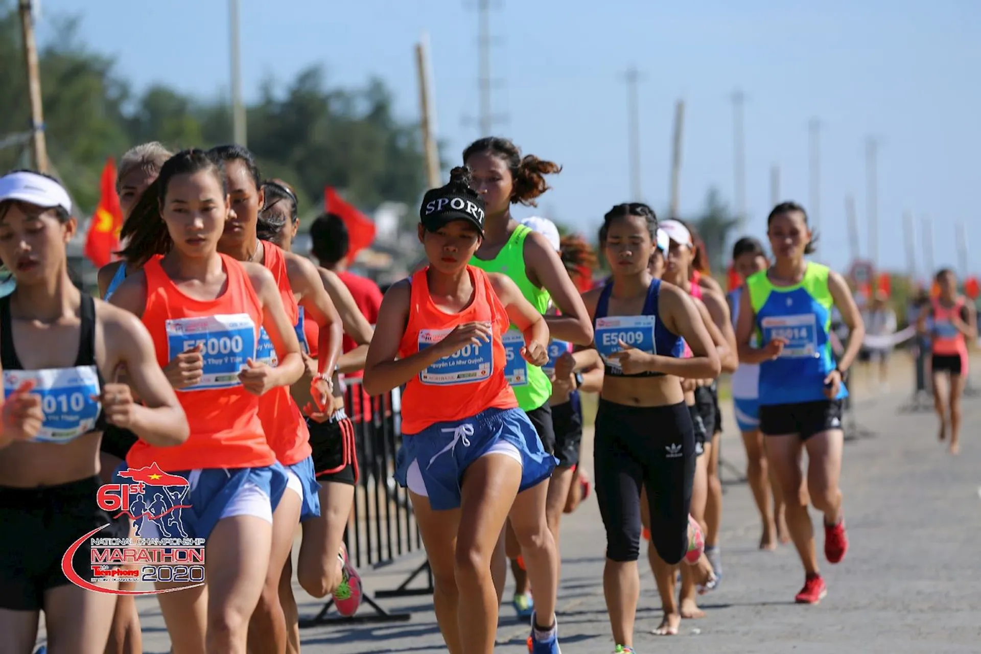 This image shows a group of runners participating in a marathon or race. They appear
