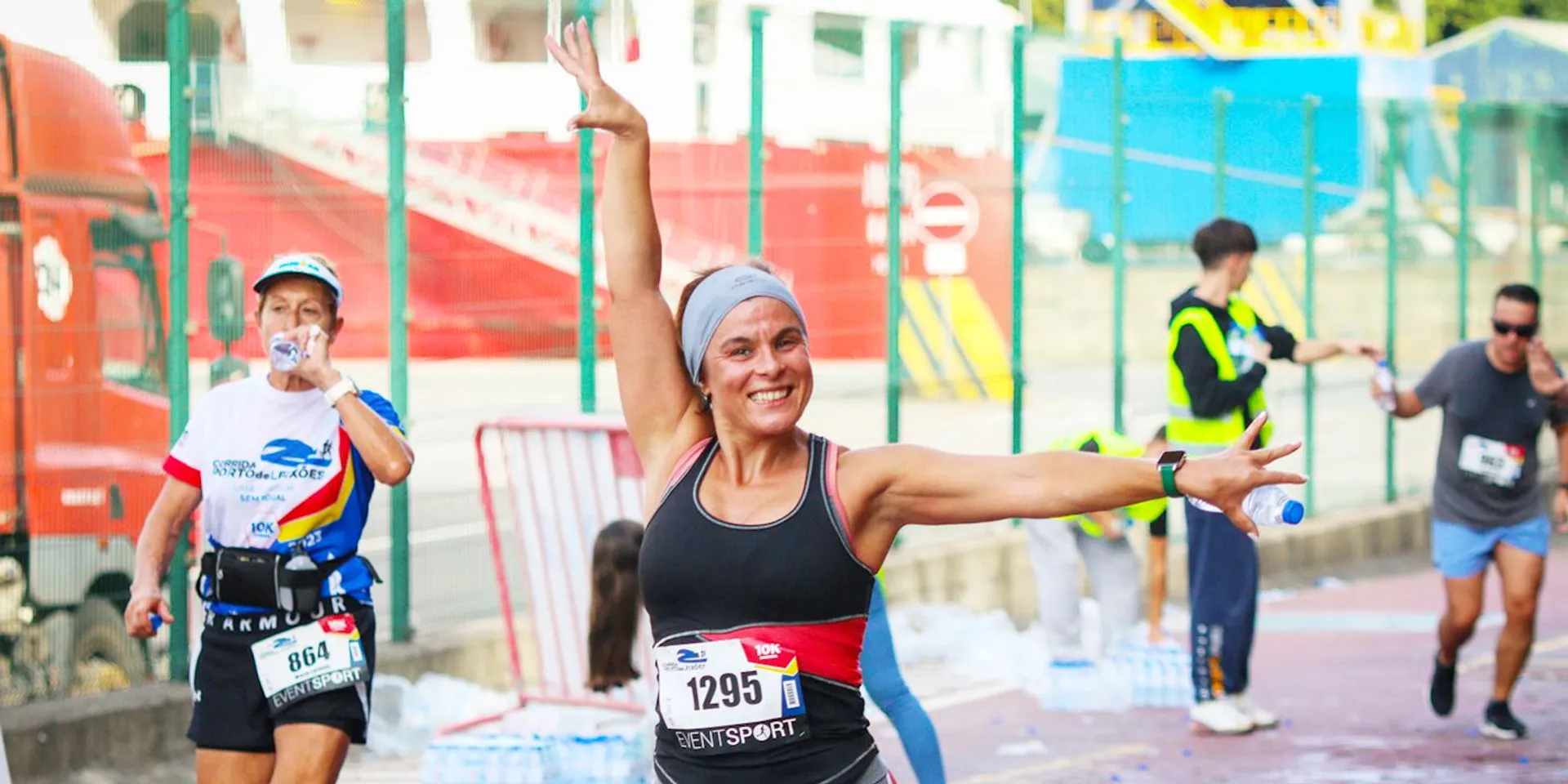 The image shows a group of people participating in a running event. You can see