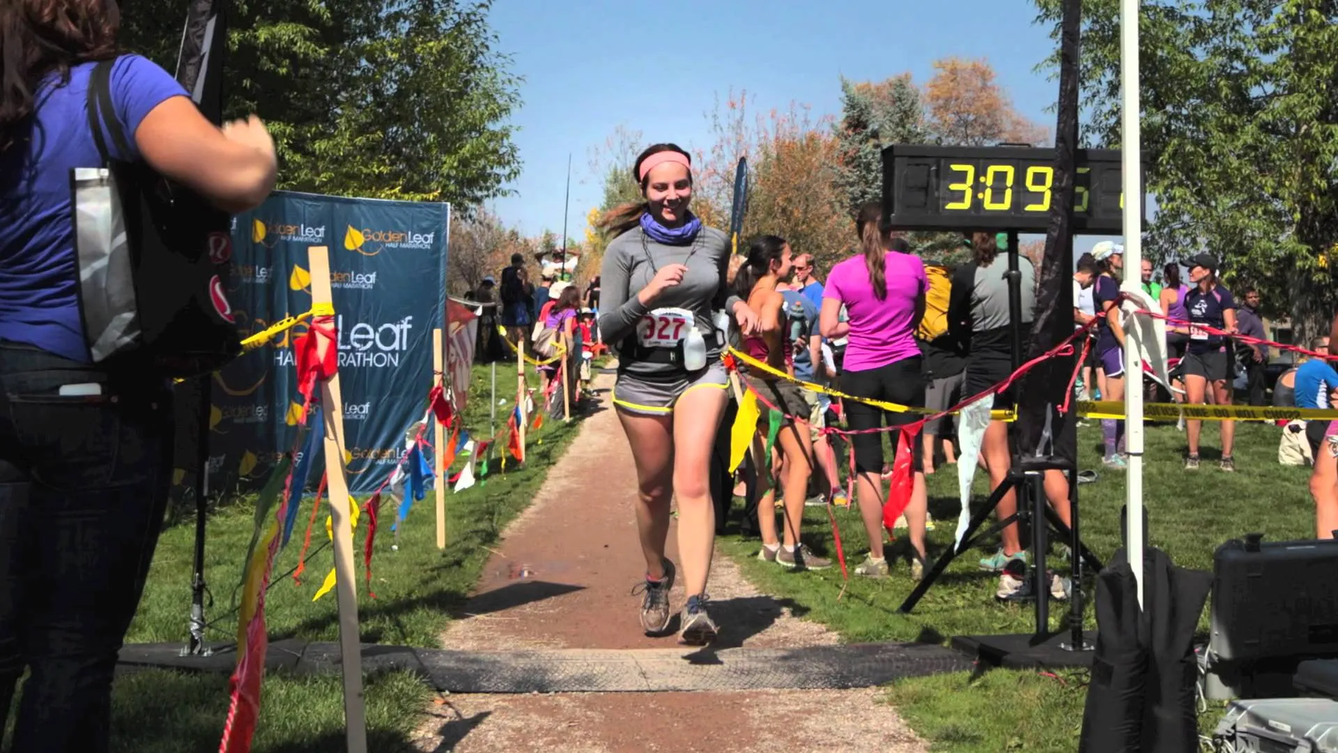 The image shows a running event, likely a marathon or a race, with a