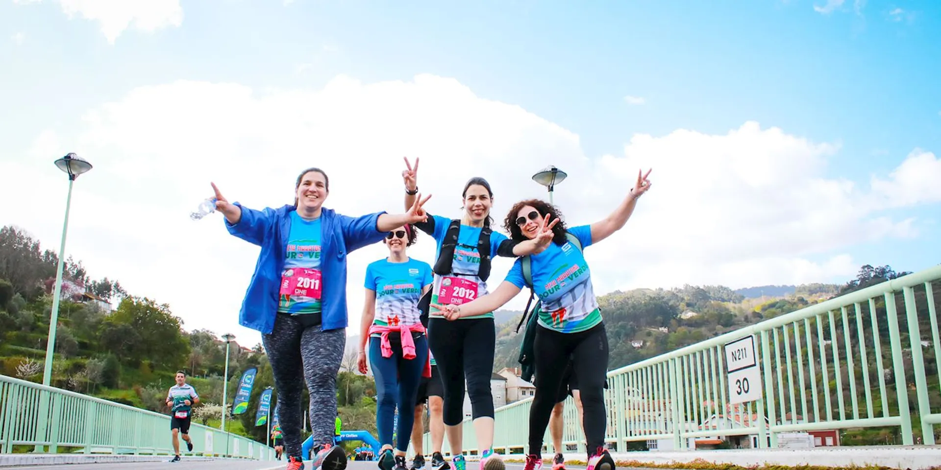 The image shows a group of people who appear to be participating in a running event